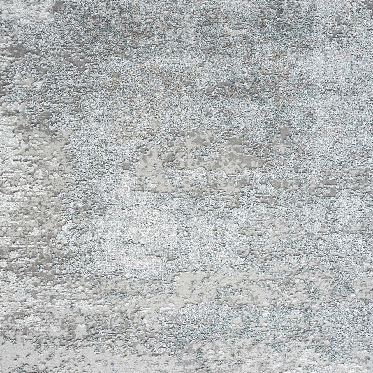 Grey and white abstract patterned modern rug with subtle blue accents and textured surface.