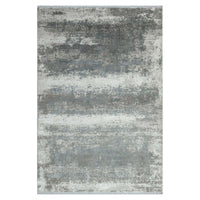 Grey white and blue abstract patterned modern rug with soft textured surface.