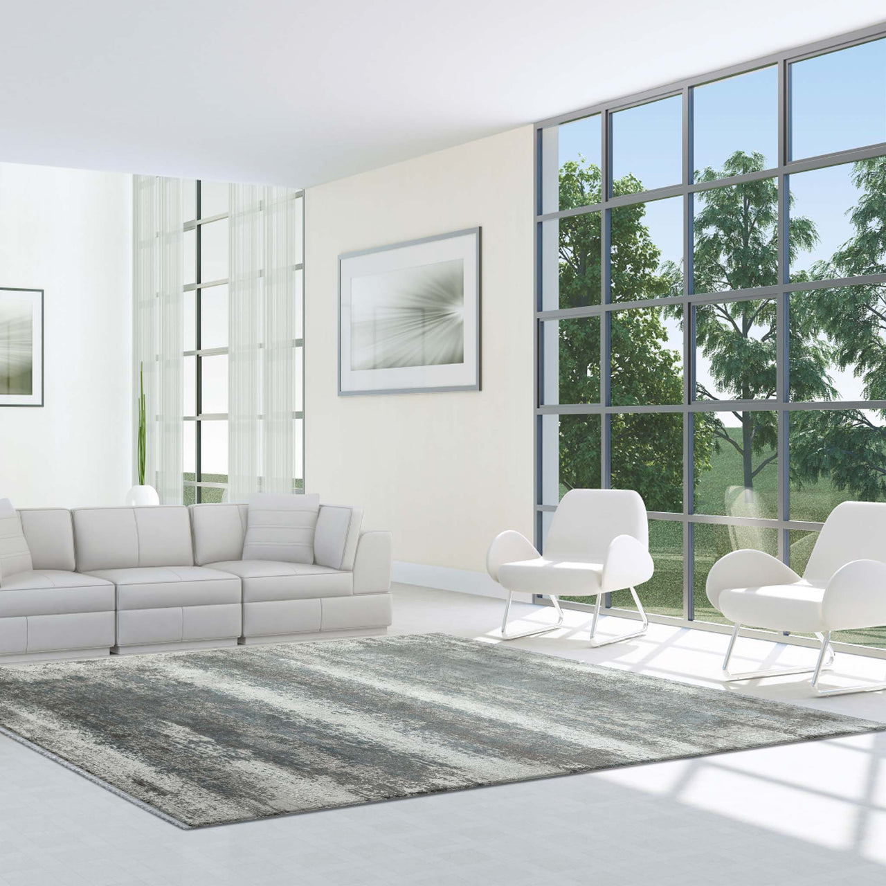 Grey, white, and blue abstract patterned modern rug with fringed edges in a bright, minimalist living room.