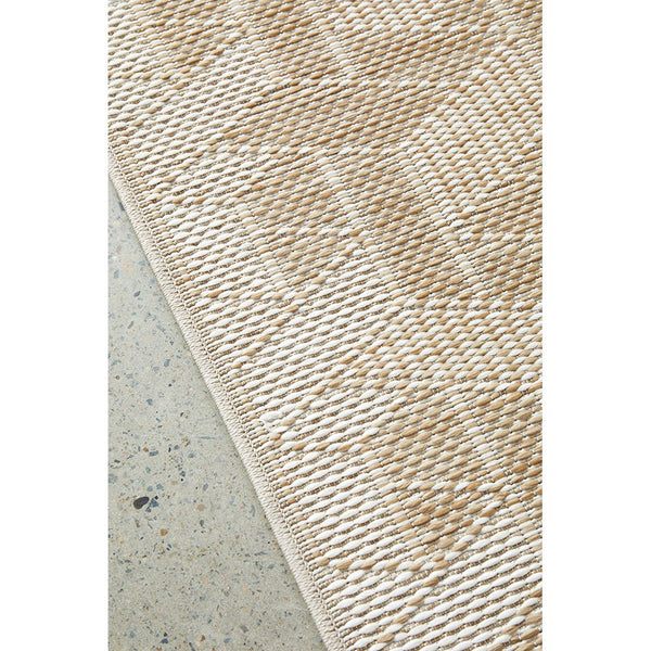 Natural cream flatweave rug with subtle geometric pattern and textured polypropylene weave.