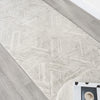 Light grey geometric textured runner rug with modern linear pattern on hardwood floor.