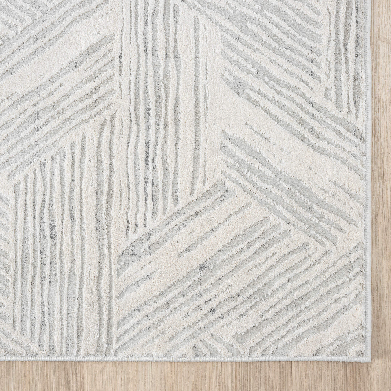 Light grey runner rug with textured geometric lines and soft neutral tones.