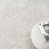 Light grey modern rug with geometric hexagon pattern and textured pile detail.