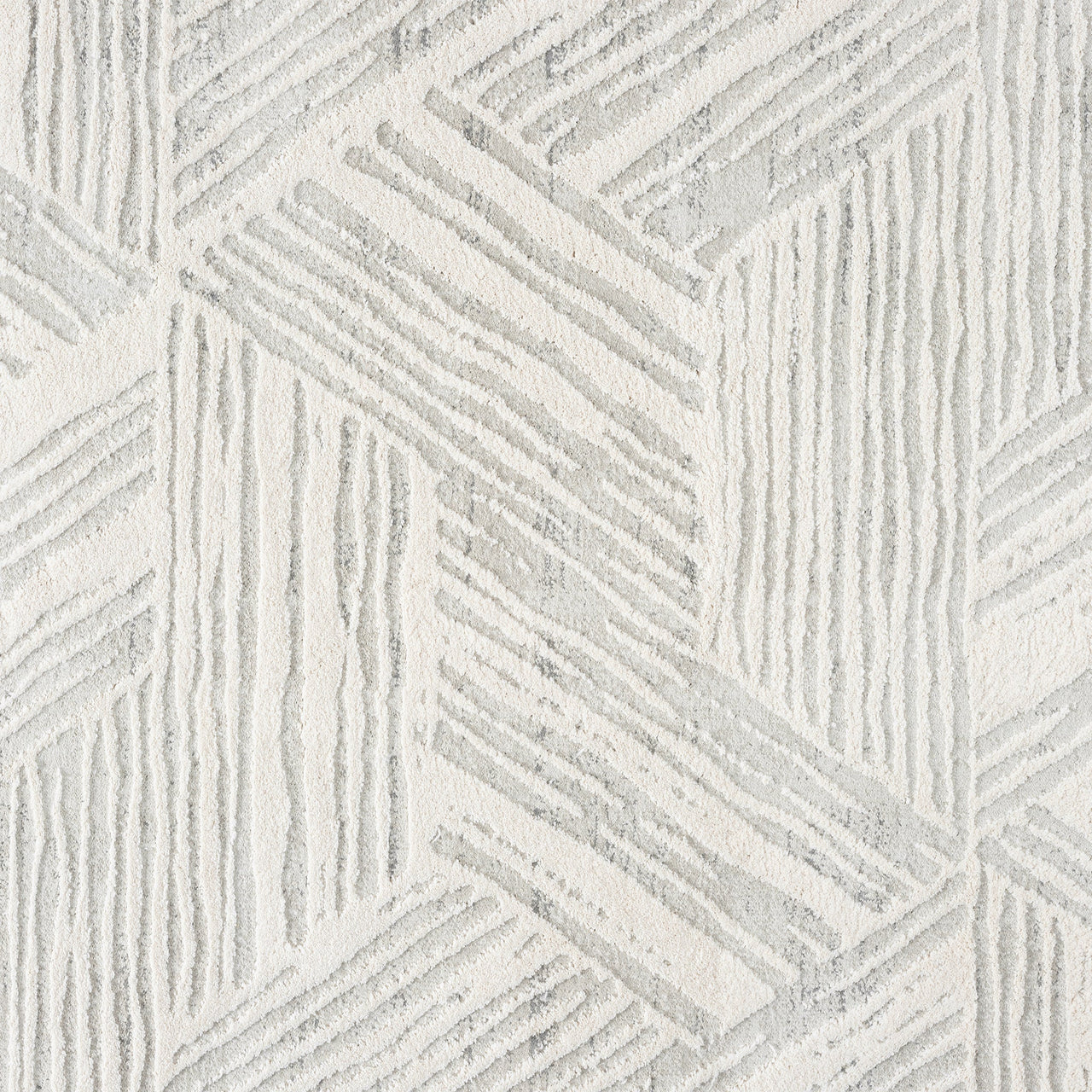 Light grey modern rug with geometric textured pattern and varied pile heights.