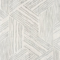 Light grey modern rug with geometric textured pattern and varied pile heights.