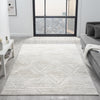 Light grey modern rug with subtle geometric textured pattern in a spacious, minimalist living room.