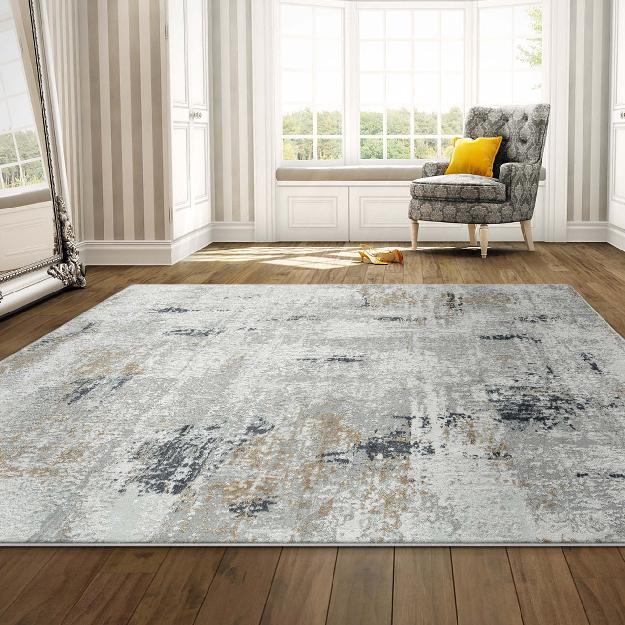 Grey multi-colored abstract modern rug with textured pile on wooden floor.