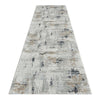 Grey multi-textured abstract runner rug with subtle pastel and neutral tones.