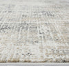 Grey multi-colored modern rug with textured, abstract patterned pile and neutral tones.