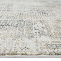 Grey and beige multi-color textured modern runner rug with abstract pattern and soft pile.