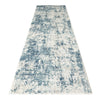 Blue and beige abstract textured modern runner rug with a distressed pattern.