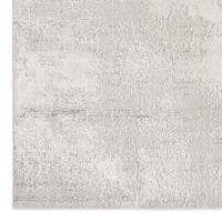 Grey runner rug with subtle textured pattern and soft neutral tones, modern style.