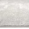 Light grey modern rug with subtle textured pattern and soft, neutral tones.