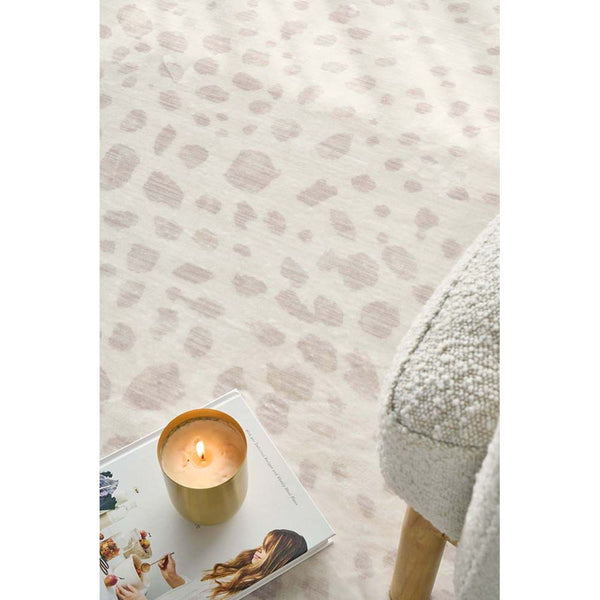 Neutral-toned modern patterned rug with soft beige and taupe abstract spots, light fabric texture.