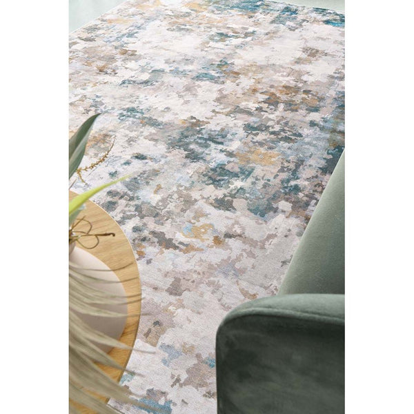 Multi-colored abstract modern rug with shades of blue, beige, and gray, soft 5mm pile.