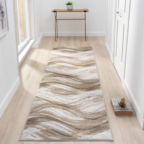 Beige and brown wavy abstract patterned modern runner rug on light wood floor in hallway.