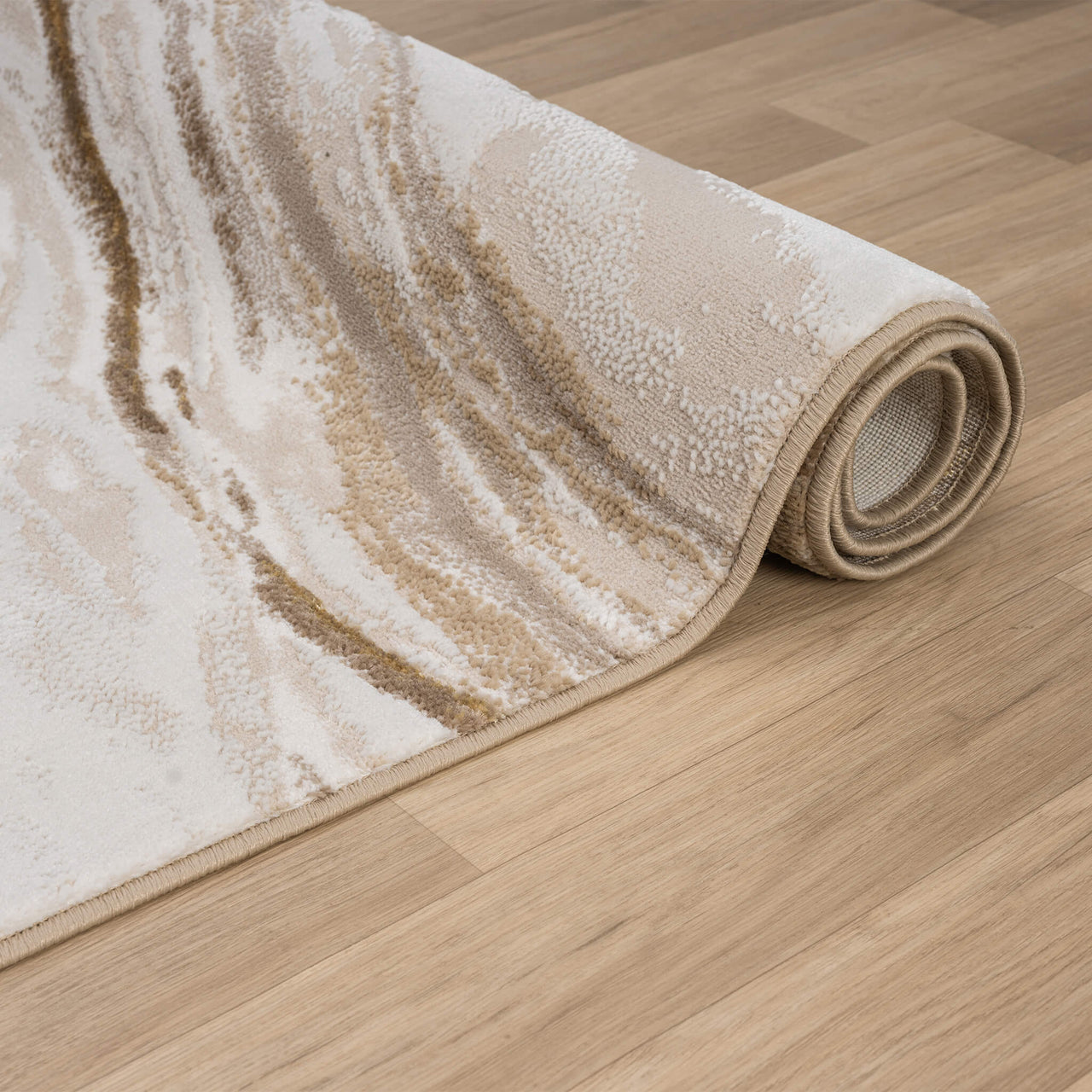 Beige and brown modern runner rug with abstract wave pattern, polyester blend, rolled on wooden floor.