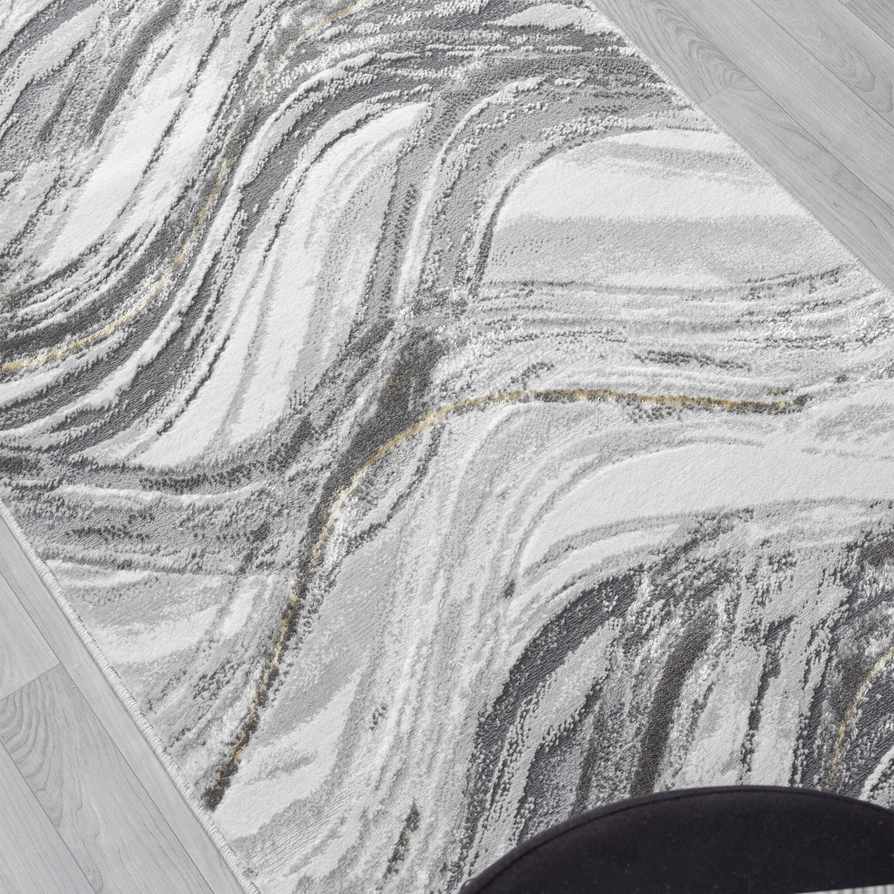 Grey and white runner rug with abstract wavy pattern and subtle gold accents.