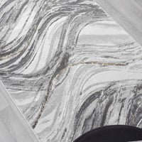Grey and white runner rug with abstract wavy pattern and subtle gold accents.