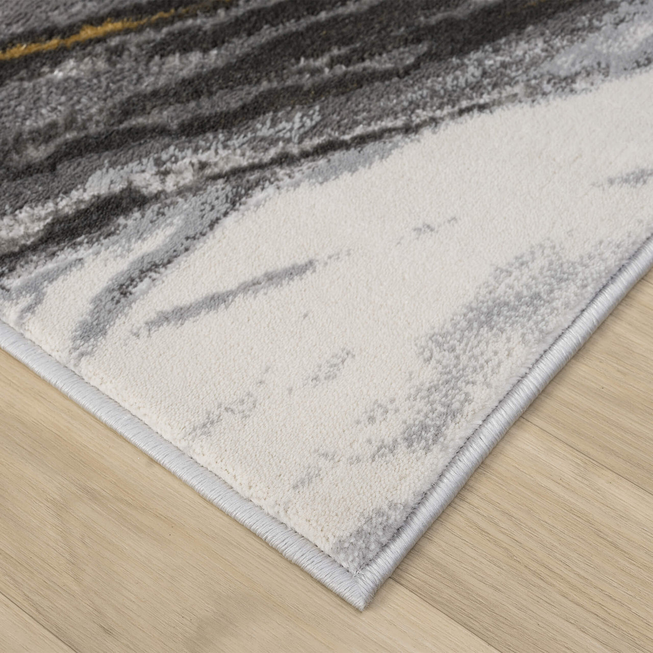 Grey and white modern runner rug with wavy abstract pattern and soft texture.