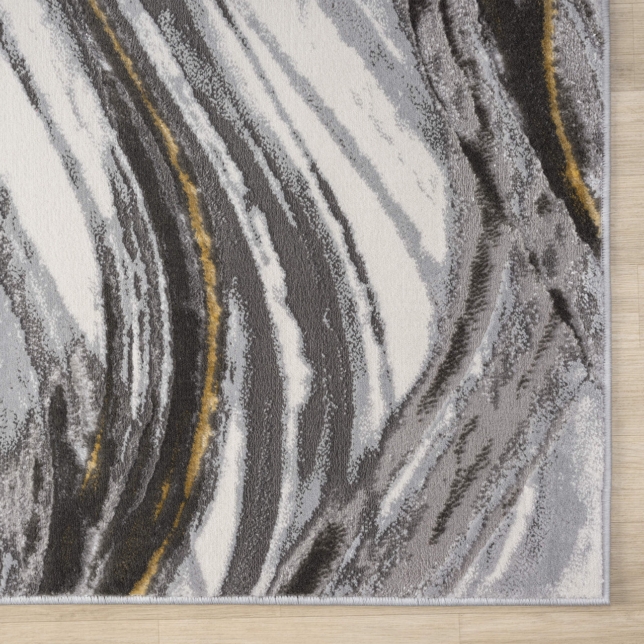 Grey runner rug with abstract wavy pattern in white, black, and gold accents, power-loomed polyester.