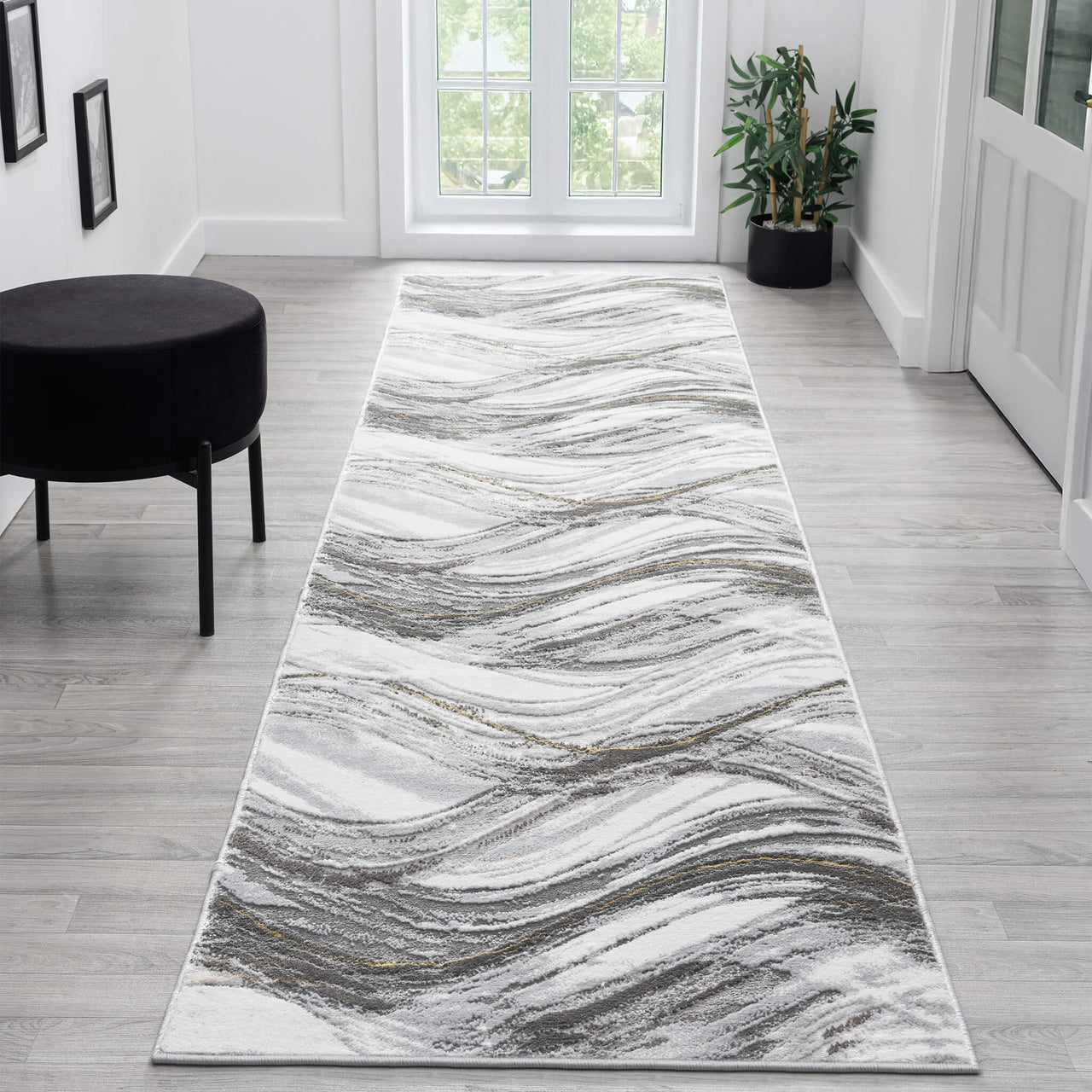 Grey and white runner rug with wavy abstract multi-colour pattern and subtle beige accents.