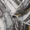 Grey runner rug with abstract wavy patterns in white, charcoal, and mustard yellow tones.