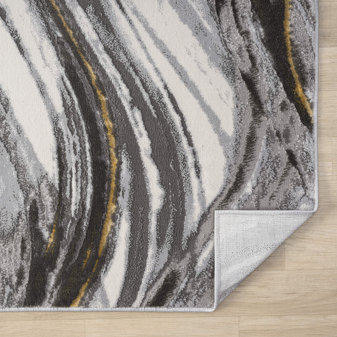 Grey runner rug with abstract wavy patterns in white, black, and mustard yellow, power-loomed polyester blend.