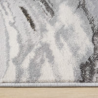 Grey and white abstract patterned modern runner rug with soft textured waves and a neatly finished edge.
