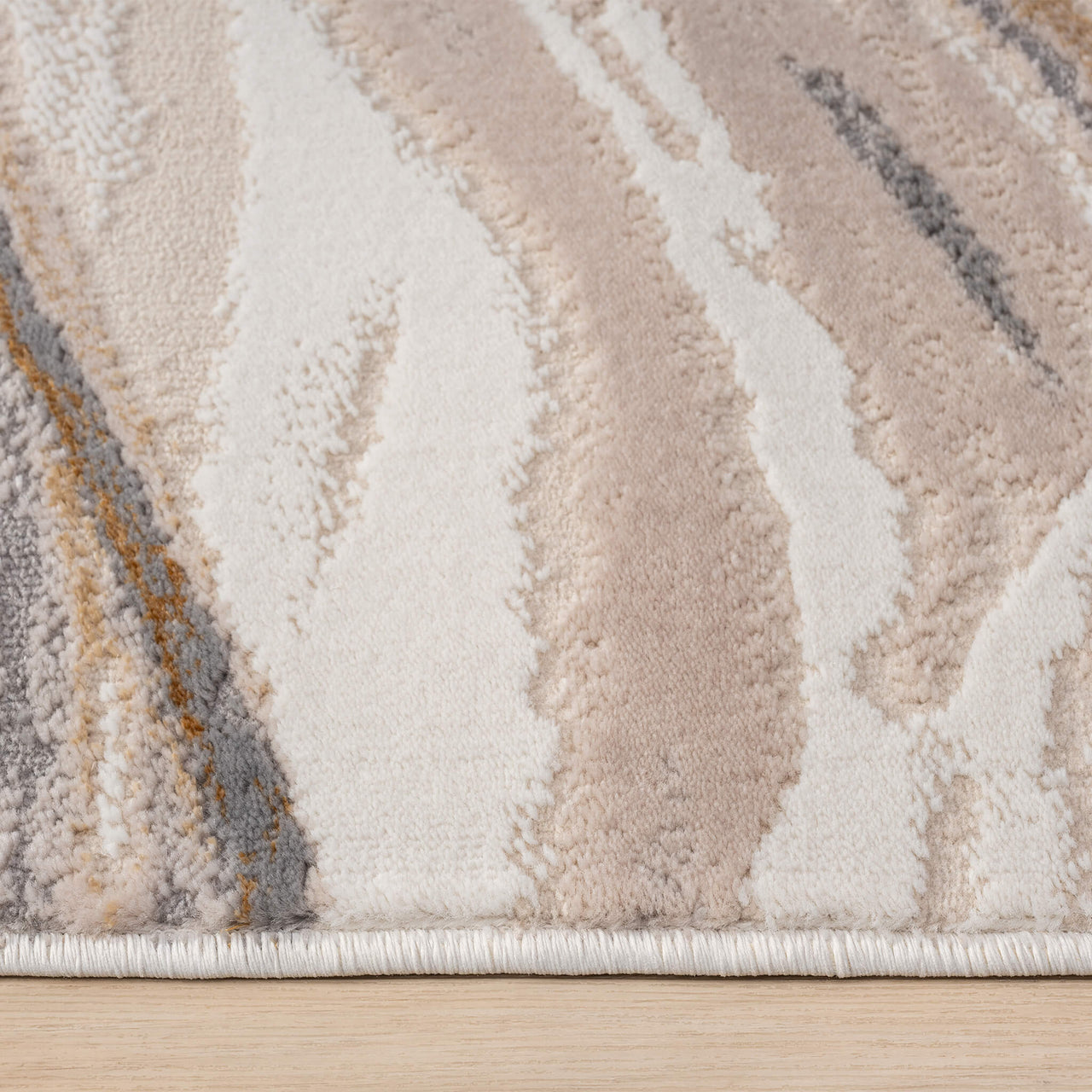 Beige runner rug with abstract wavy patterns in cream, taupe, gray, and muted gold tones.