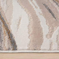 Beige runner rug with abstract wavy patterns in cream, taupe, gray, and muted gold tones.