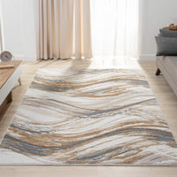 Beige modern rug with abstract wavy pattern in blue, gray, and gold tones on a light background.