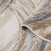 Beige modern rug with abstract wavy pattern in shades of cream, tan, and gray, folded corner showing texture.