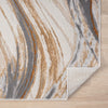 Beige modern rug with abstract wavy pattern in grey, white, and brown tones on wood floor.