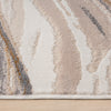 Beige modern rug with wavy abstract pattern in cream, taupe, gray, and mustard tones.