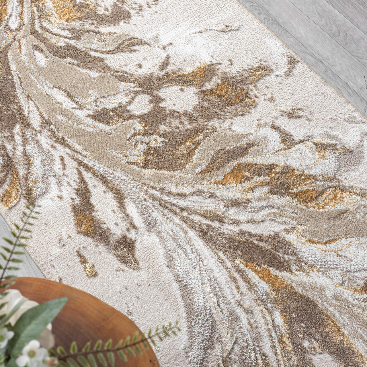 Beige and gold abstract patterned modern runner rug with multi-color swirling design on light background.