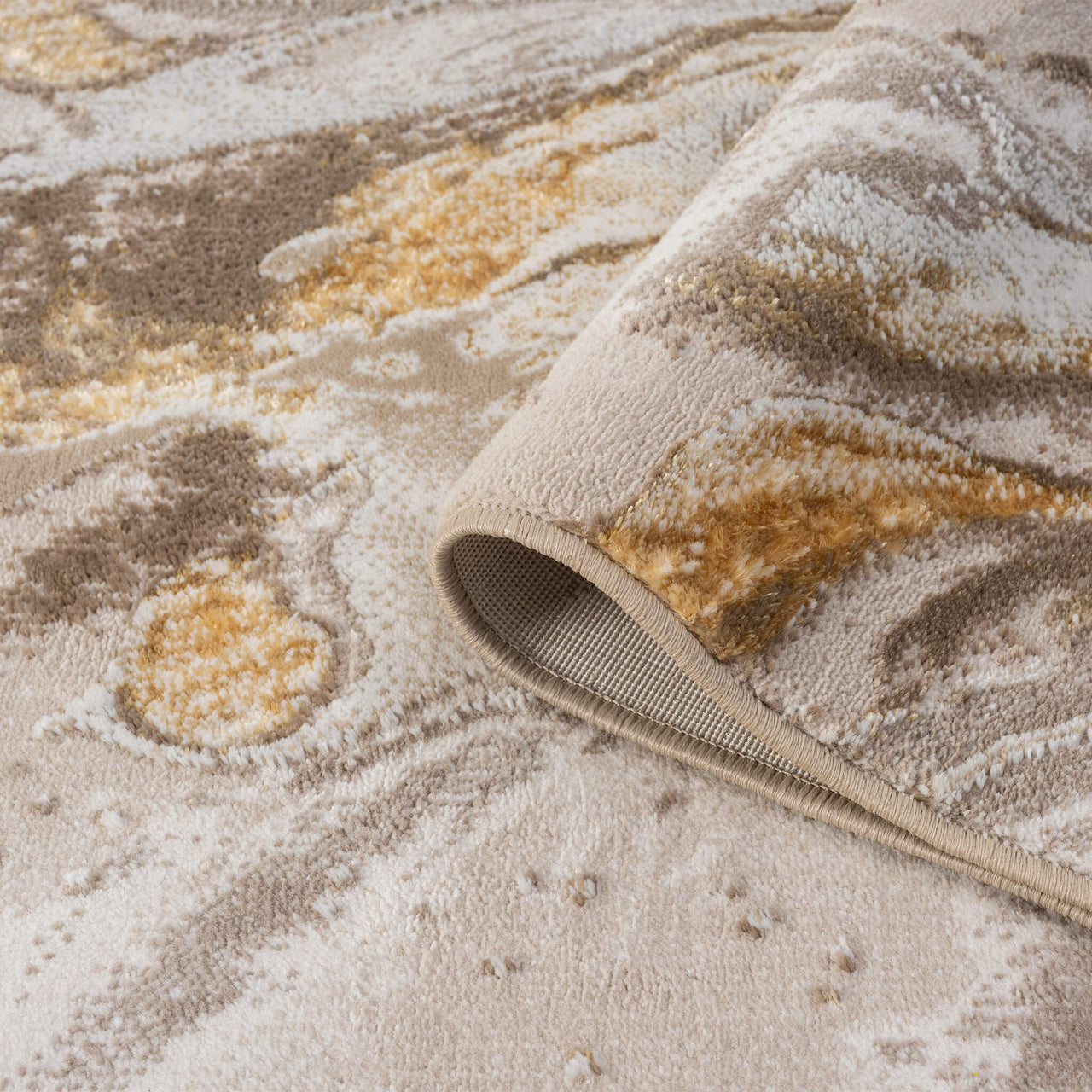 Beige runner rug with gold, brown, and gray abstract patterns, power-loomed polyester blend.