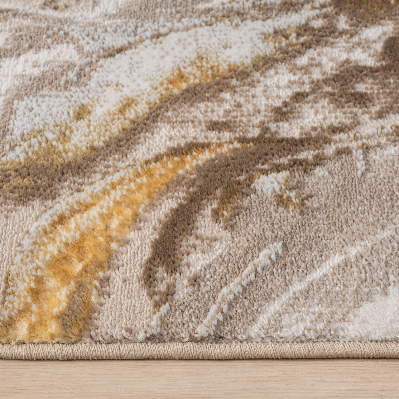 Beige runner rug with abstract gold and brown swirling pattern on polyester blend material.
