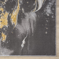 Grey runner rug with abstract multi-color pattern featuring yellow and white accents, power-loomed texture.