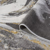 Grey runner rug with abstract multi-color pattern in shades of white, yellow, and muted gold, soft polyester texture,.