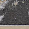 Grey runner rug with abstract multi-colour pattern in white and yellow tones, soft textured polyester surface.