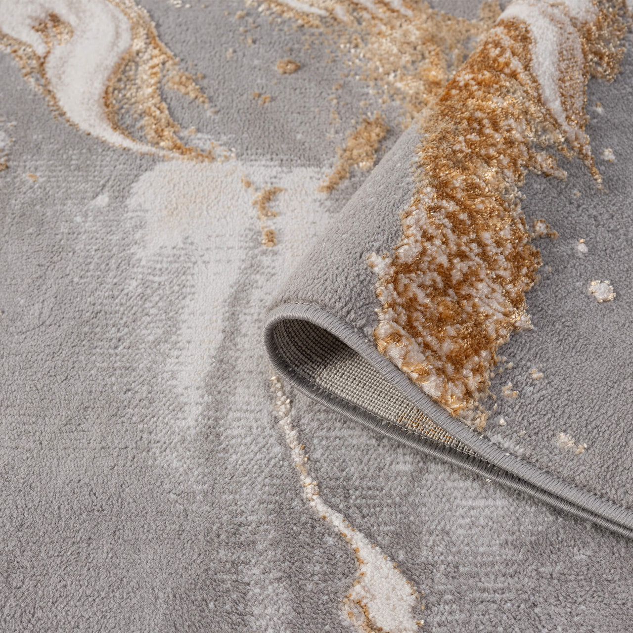 Beige modern runner rug with abstract multi-color pattern in shades of white, gray, and brown.