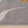Close-up of beige modern runner rug with abstract multi-color pattern and soft texture.