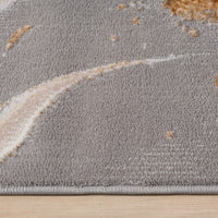 Close-up of beige modern runner rug with abstract multi-color pattern and soft texture.