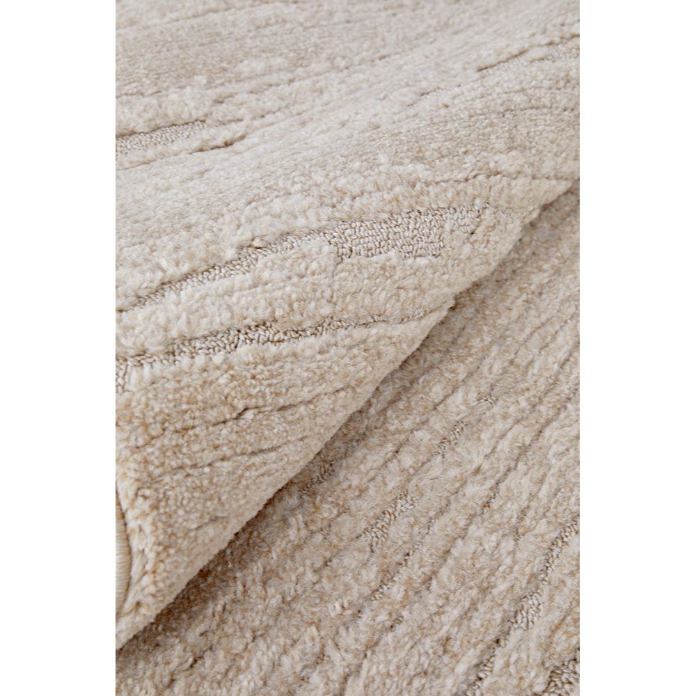 Close-up of beige textured fabric