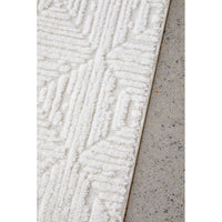 Textured white rug on a concrete floor
