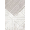 Close-up of textured beige and white rug with geometric pattern