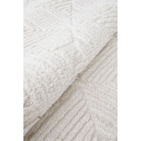 Close-up of textured white fabric with a subtle pattern
