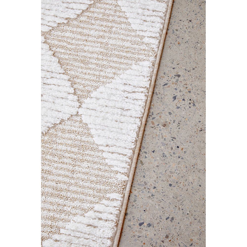 Close-up of textured rug and concrete floor surface