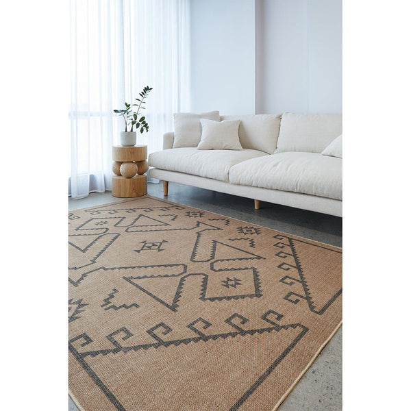 Beige rug with geometric pattern in a living room setting